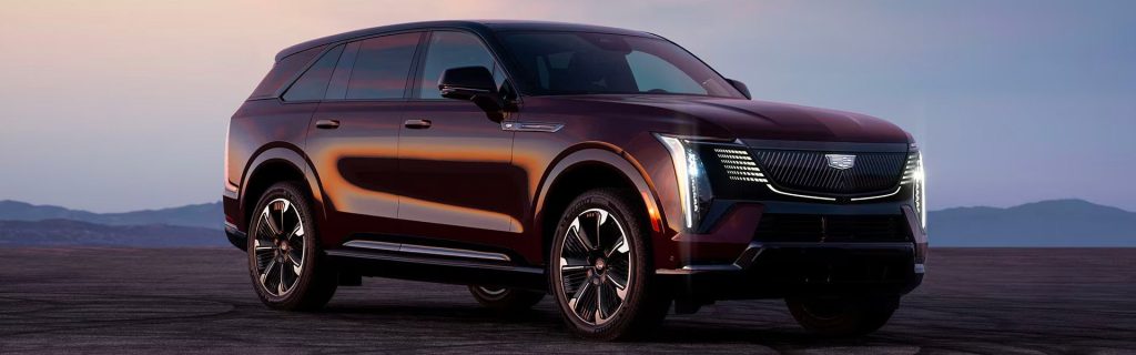 2025 Cadillac Escalade IQ parked on a plateau at twilight